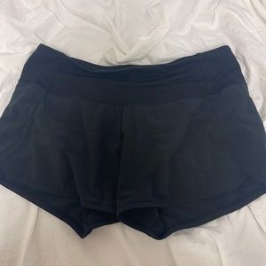 Lululemon black 2.5inch shorts some wear on the logo